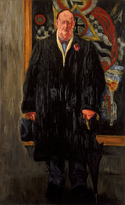 Marsden Hartley standing before 